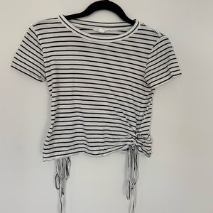 Black and white top with detail on the sides.